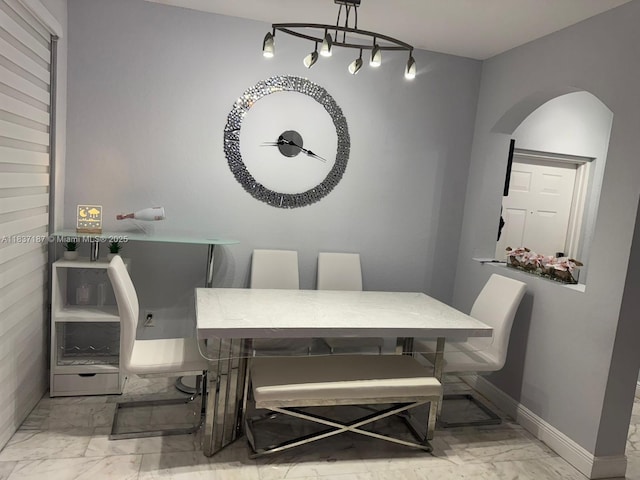 4301 SW 160th Ave Unit 215, Miramar, FL 33027 - dining area featuring marble finish floors and arched walkways