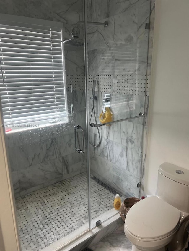 4301 SW 160th Ave Unit 215, Miramar, FL 33027 - bathroom with a marble finish shower and toilet