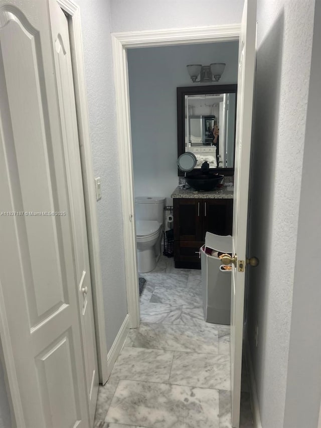 4301 SW 160th Ave Unit 215, Miramar, FL 33027 - hall with a sink and light marble finish flooring