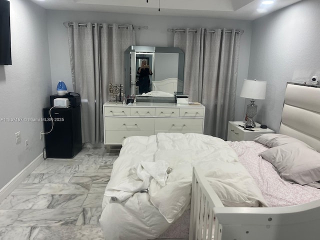 4301 SW 160th Ave Unit 215, Miramar, FL 33027 - bedroom with baseboards and light marble finish flooring