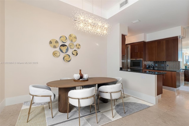 18101 Collins Ave Unit Ph5104, Sunny Isles Beach, FL 33160 - dining room featuring a chandelier and light tile patterned floors