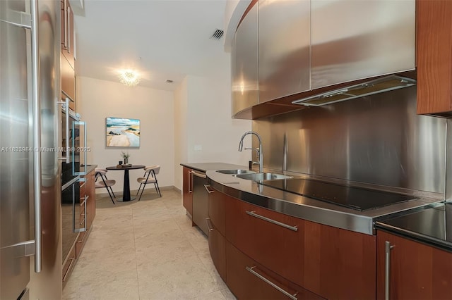 18101 Collins Ave Unit Ph5104, Sunny Isles Beach, FL 33160 - kitchen featuring modern cabinets, stainless steel refrigerator, and black electric cooktop