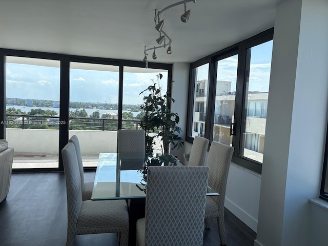 3589 S Ocean Blvd Unit 914, South Palm Beach, FL 33480 - dining area with a water view, expansive windows, and rail lighting