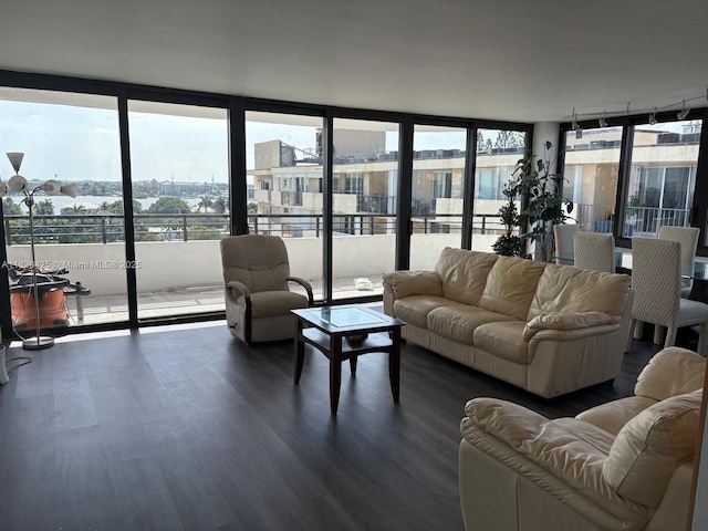 3589 S Ocean Blvd Unit 914, South Palm Beach, FL 33480 - living area featuring dark wood-style floors, plenty of natural light, floor to ceiling windows, and track lighting
