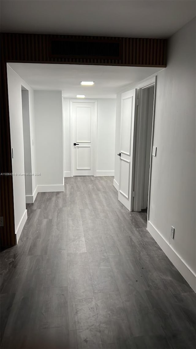 3589 S Ocean Blvd Unit 914, South Palm Beach, FL 33480 - empty room with dark wood-style floors
