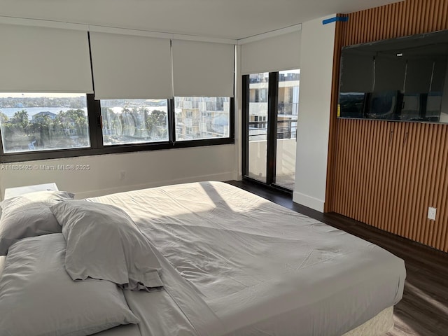 3589 S Ocean Blvd Unit 914, South Palm Beach, FL 33480 - bedroom with wood finished floors and access to exterior