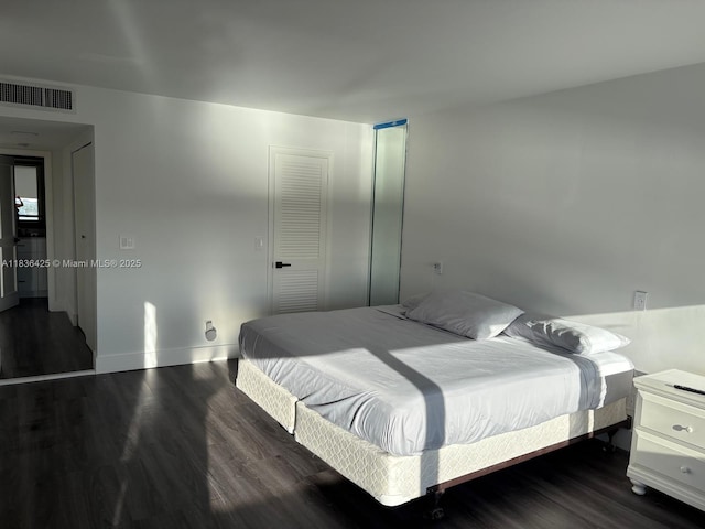 3589 S Ocean Blvd Unit 914, South Palm Beach, FL 33480 - bedroom with dark wood-type flooring