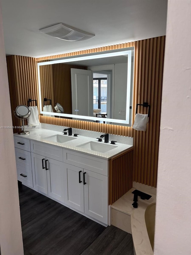 3589 S Ocean Blvd Unit 914, South Palm Beach, FL 33480 - bathroom featuring wood finished floors and double vanity