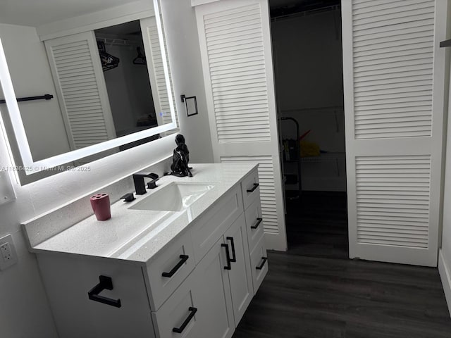 3589 S Ocean Blvd Unit 914, South Palm Beach, FL 33480 - bathroom with vanity and wood finished floors