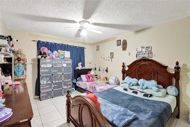 2220 SW 12th St, Miami, FL 33135 - bedroom with light tile patterned floors, a textured ceiling, and a ceiling fan