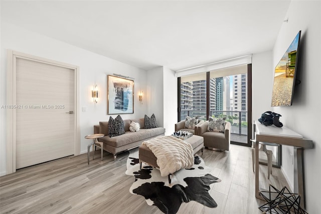 801 S Miami Ave Unit 1210, Miami, FL 33130 - living room with floor to ceiling windows and light wood-style flooring