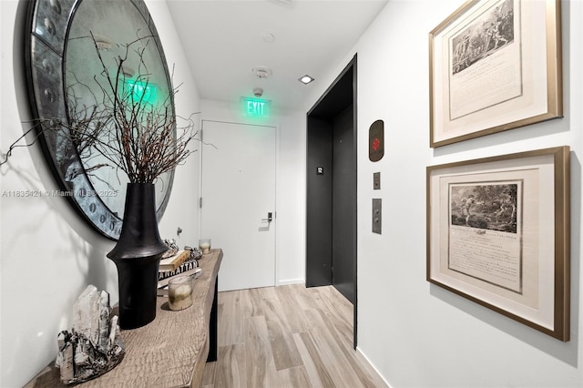 801 S Miami Ave Unit 1210, Miami, FL 33130 - hallway featuring elevator and light wood-style flooring