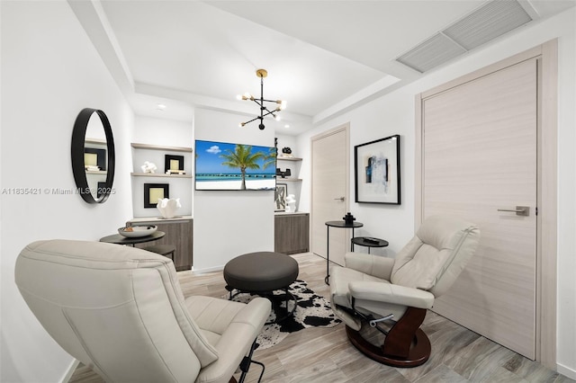801 S Miami Ave Unit 1210, Miami, FL 33130 - office area with a chandelier, wood finished floors, a tray ceiling, recessed lighting, and built in shelves