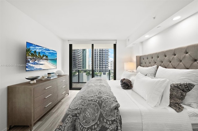 801 S Miami Ave Unit 1210, Miami, FL 33130 - bedroom with floor to ceiling windows, light wood-type flooring, and recessed lighting