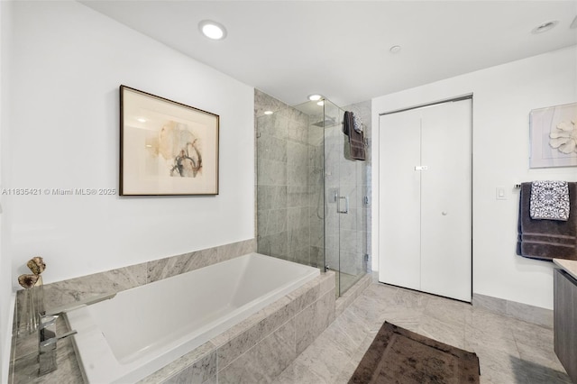 801 S Miami Ave Unit 1210, Miami, FL 33130 - bathroom with a bath, a stall shower, vanity, and recessed lighting