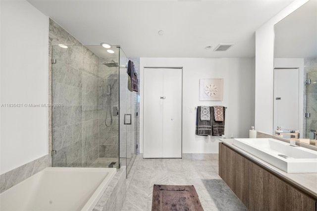 801 S Miami Ave Unit 1210, Miami, FL 33130 - bathroom with vanity, a shower stall, a bath, recessed lighting, and marble finish flooring