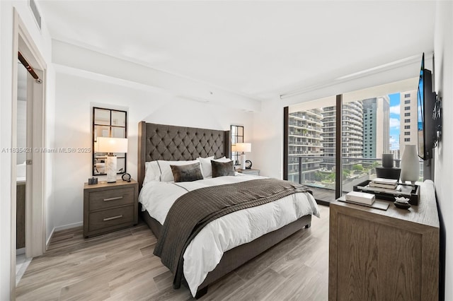 801 S Miami Ave Unit 1210, Miami, FL 33130 - bedroom featuring light wood-style flooring