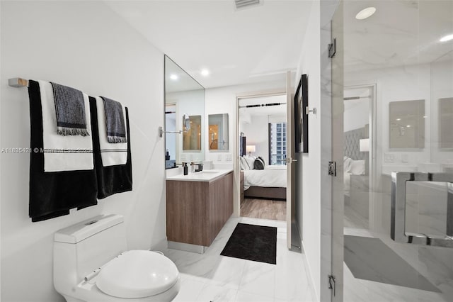 801 S Miami Ave Unit 1210, Miami, FL 33130 - ensuite bathroom featuring a marble finish shower, marble look tile flooring, vanity, and recessed lighting