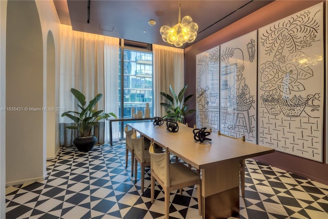 801 S Miami Ave Unit 1210, Miami, FL 33130 - dining area with tile patterned floors, arched walkways, and a chandelier