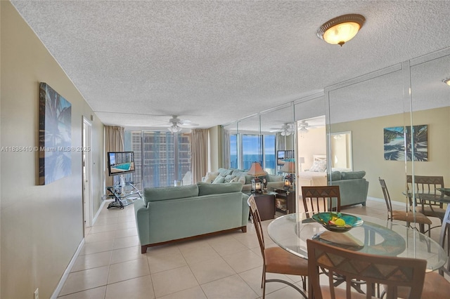 531 N Ocean Blvd Unit 1108, Pompano Beach, FL 33062 - dining area with a ceiling fan, a textured ceiling, and light tile patterned flooring