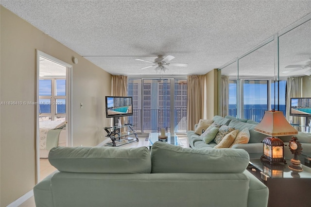 531 N Ocean Blvd Unit 1108, Pompano Beach, FL 33062 - living area with a ceiling fan, a textured ceiling, and healthy amount of natural light