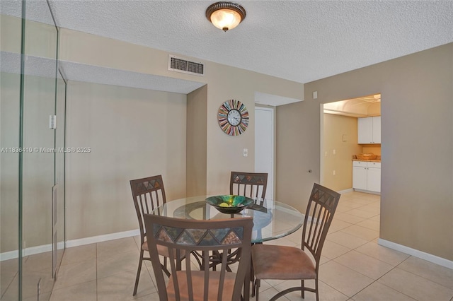 531 N Ocean Blvd Unit 1108, Pompano Beach, FL 33062 - dining room featuring light tile patterned floors and a textured ceiling