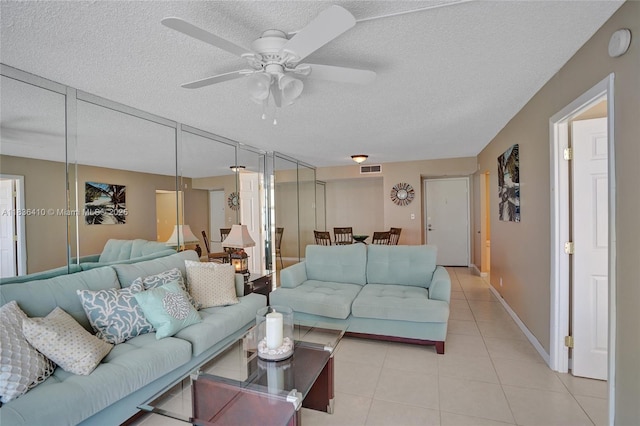 531 N Ocean Blvd Unit 1108, Pompano Beach, FL 33062 - living room featuring light tile patterned flooring, a textured ceiling, and ceiling fan