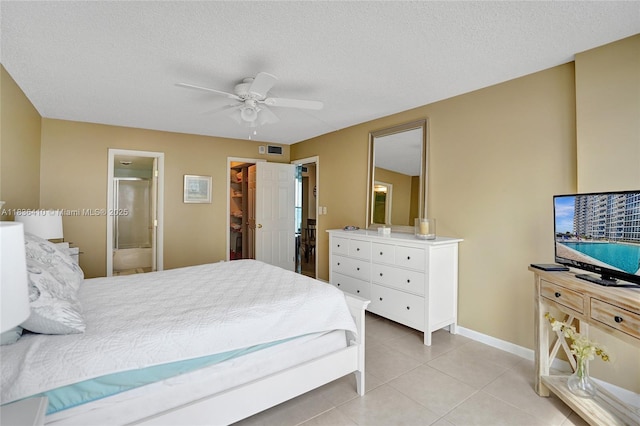 531 N Ocean Blvd Unit 1108, Pompano Beach, FL 33062 - bedroom featuring light tile patterned flooring, ceiling fan, ensuite bathroom, a textured ceiling, and a walk in closet