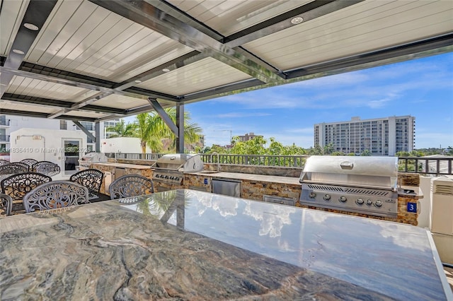 531 N Ocean Blvd Unit 1108, Pompano Beach, FL 33062 - view of patio / terrace featuring an outdoor kitchen and outdoor dining area
