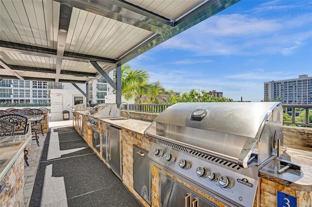 531 N Ocean Blvd Unit 1108, Pompano Beach, FL 33062 - view of patio / terrace featuring an outdoor kitchen and a sink