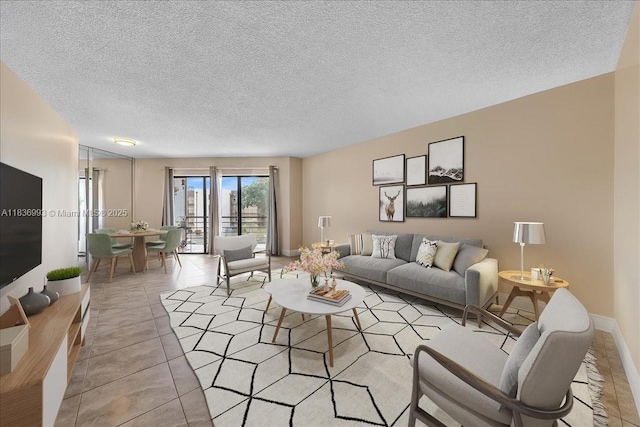 6555 W Broward Blvd Unit 300, Plantation, FL 33317 - tiled living area with a textured ceiling and baseboards