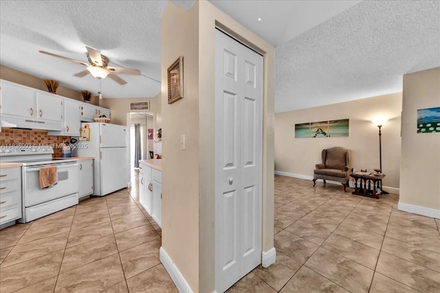 6555 W Broward Blvd Unit 300, Plantation, FL 33317 - kitchen featuring white appliances, under cabinet range hood, a ceiling fan, a textured ceiling, and light countertops