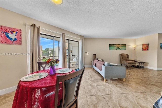 6555 W Broward Blvd Unit 300, Plantation, FL 33317 - dining area featuring a textured ceiling
