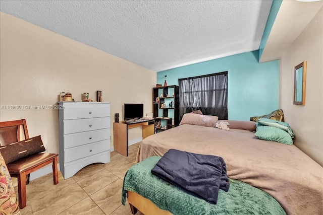 6555 W Broward Blvd Unit 300, Plantation, FL 33317 - bedroom with a textured ceiling and light tile patterned flooring