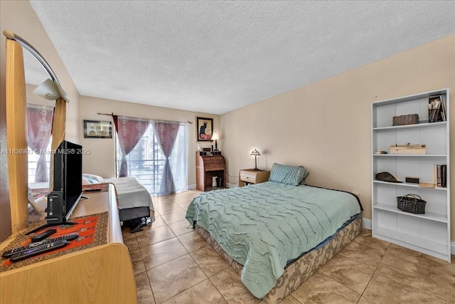 6555 W Broward Blvd Unit 300, Plantation, FL 33317 - bedroom featuring a textured ceiling and light tile patterned floors