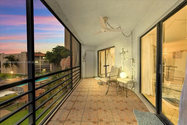 6555 W Broward Blvd Unit 300, Plantation, FL 33317 - balcony featuring a ceiling fan
