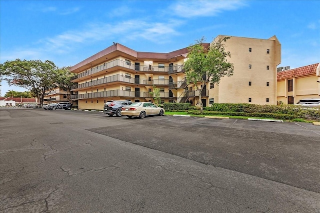 6555 W Broward Blvd Unit 300, Plantation, FL 33317 - view of apartment building / complex with uncovered parking