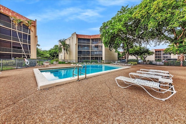 6555 W Broward Blvd Unit 300, Plantation, FL 33317 - community pool featuring a patio area