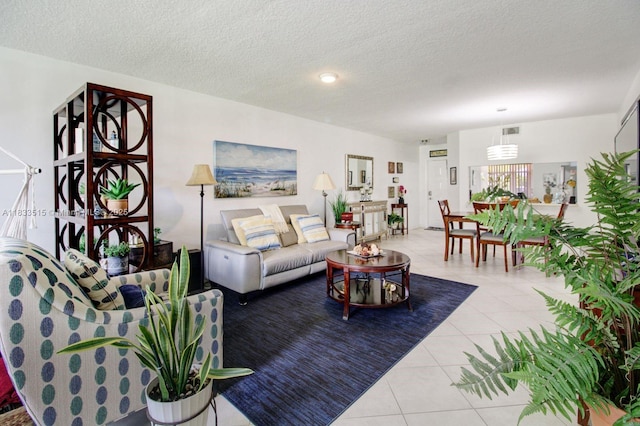 2524 NW 104th Ave Unit 101, Sunrise, FL 33322 - tiled living room with a textured ceiling