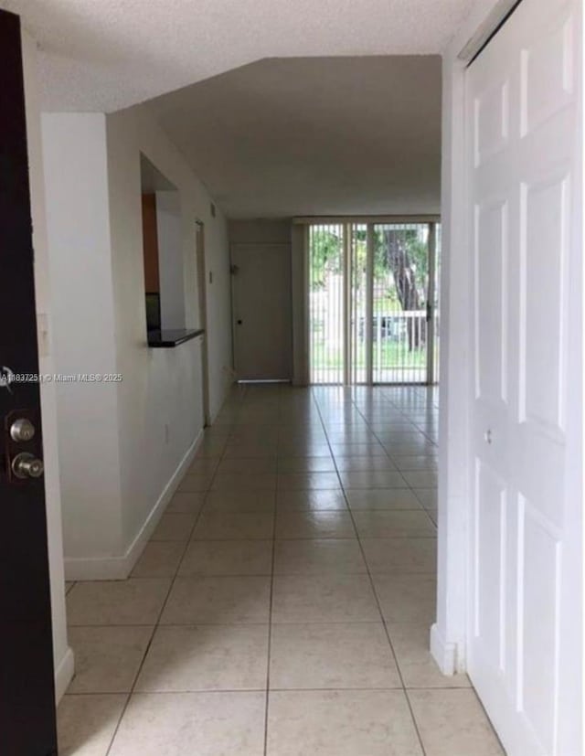 4653 NW 97 Unit 21, Doral, FL 33178 - corridor featuring light tile patterned flooring