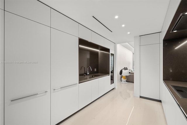 300 Biscayne Boulevard Way Unit 2703, Miami, FL 33131 - kitchen with modern cabinets, white cabinets, recessed lighting, and dark countertops