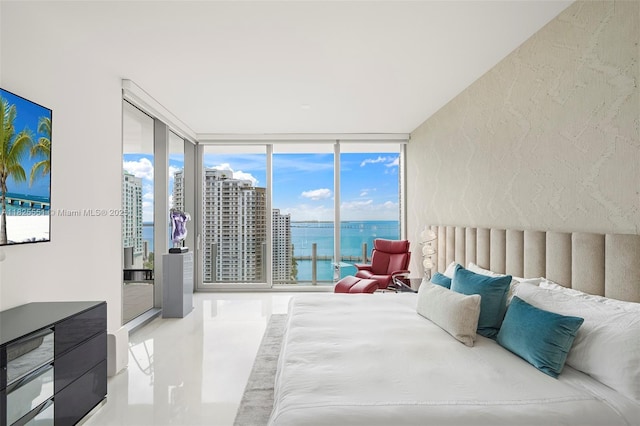 300 Biscayne Boulevard Way Unit 2703, Miami, FL 33131 - bedroom with expansive windows, access to outside, a water view, and tile patterned floors