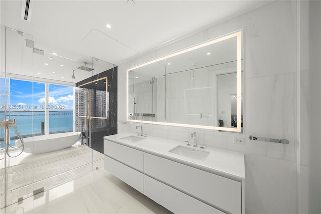 300 Biscayne Boulevard Way Unit 2703, Miami, FL 33131 - full bath with double vanity, a soaking tub, a shower stall, a water view, and recessed lighting