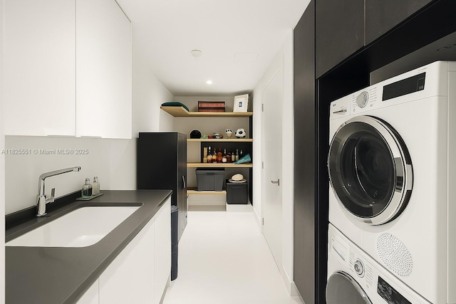 300 Biscayne Boulevard Way Unit 2703, Miami, FL 33131 - washroom with stacked washing machine and dryer and cabinet space