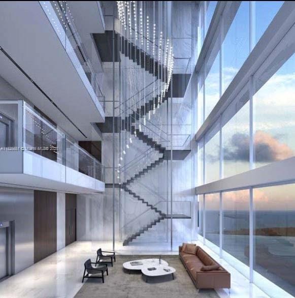 300 Biscayne Boulevard Way Unit 2703, Miami, FL 33131 - common area featuring a towering ceiling and floor to ceiling windows