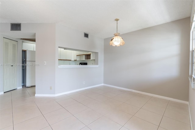 1000 SW 128th Ter Unit 312V, Pembroke Pines, FL 33027 - unfurnished room featuring light tile patterned floors and a textured ceiling