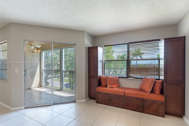 1000 SW 128th Ter Unit 312V, Pembroke Pines, FL 33027 - sitting room featuring a ceiling fan, a textured ceiling, and light tile patterned flooring