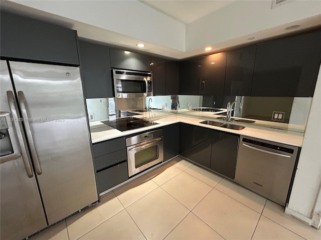 31 SE 6th St Unit 407, Miami, FL 33131 - kitchen with stainless steel appliances, light countertops, modern cabinets, dark cabinets, and recessed lighting