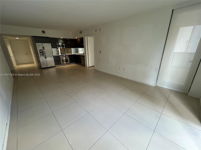 31 SE 6th St Unit 407, Miami, FL 33131 - unfurnished living room featuring light tile patterned flooring
