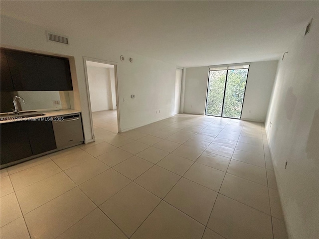 31 SE 6th St Unit 407, Miami, FL 33131 - unfurnished living room featuring a sink and light tile patterned flooring